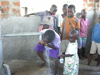 Children drinking clean water for first time